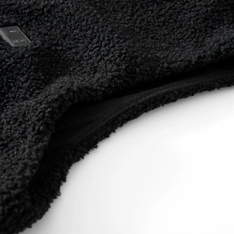 Närbild på materialet i HeatWrap värmvästen, 95% polyester 5% spandex